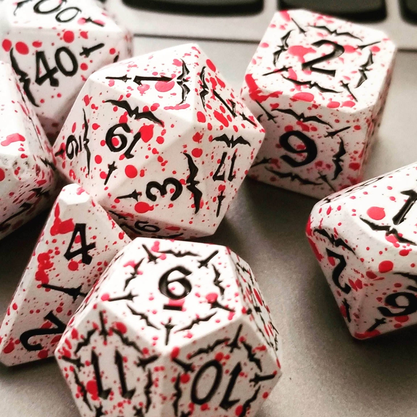 Battle Hardened Dice: White metal dice w/Black numbering and Red Splatter 7- Dice Set Rpg -