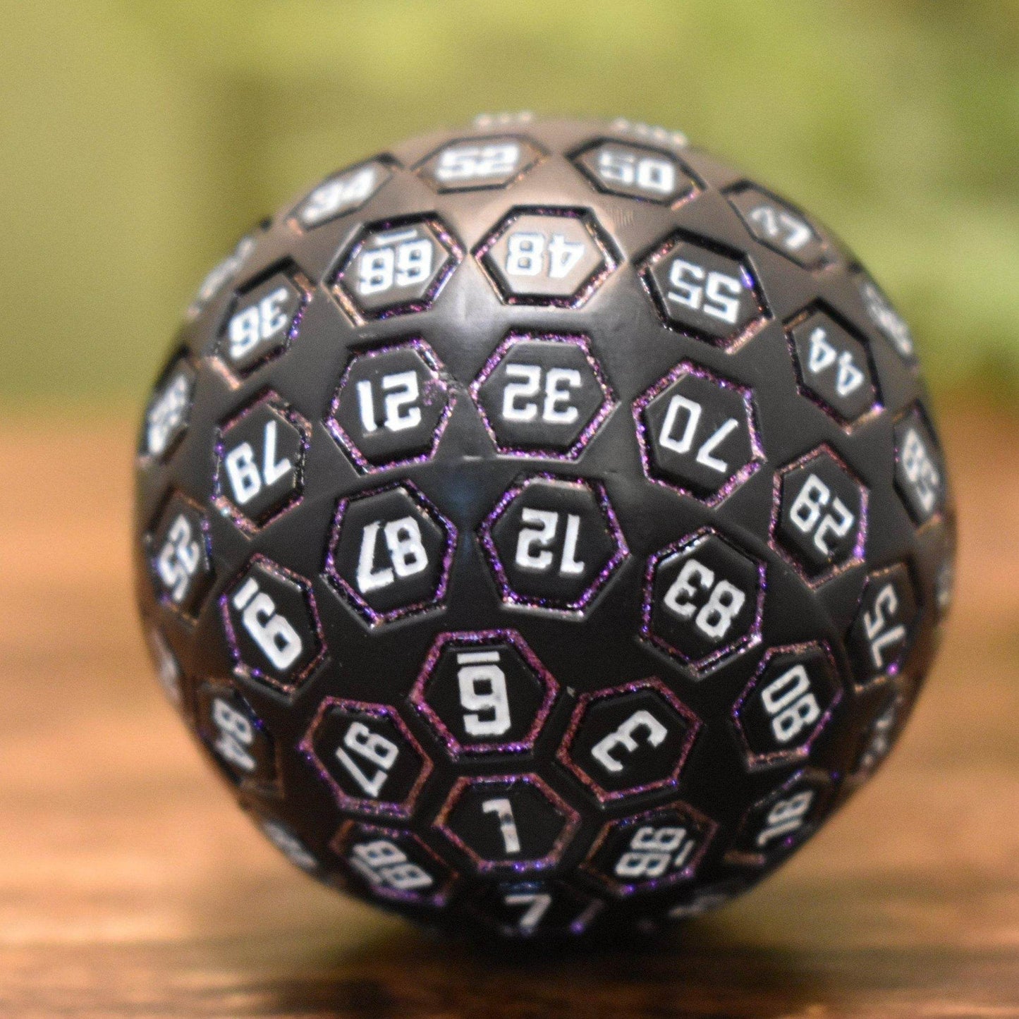The Orb D100 - Purple, White, and Black Metal Die -