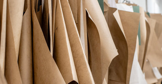 Set of sewing patterns on hangers inside tailor atelier or studio