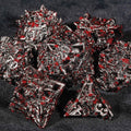 Bloodstained dragon head shaped metal hollow DND dice set