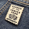 Banned By the CCA 1.5" hard enamel pin