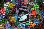 Premium Mystery Dice Set – 100's of different dice, stickers and pins! Handpacked in Portland, OR.