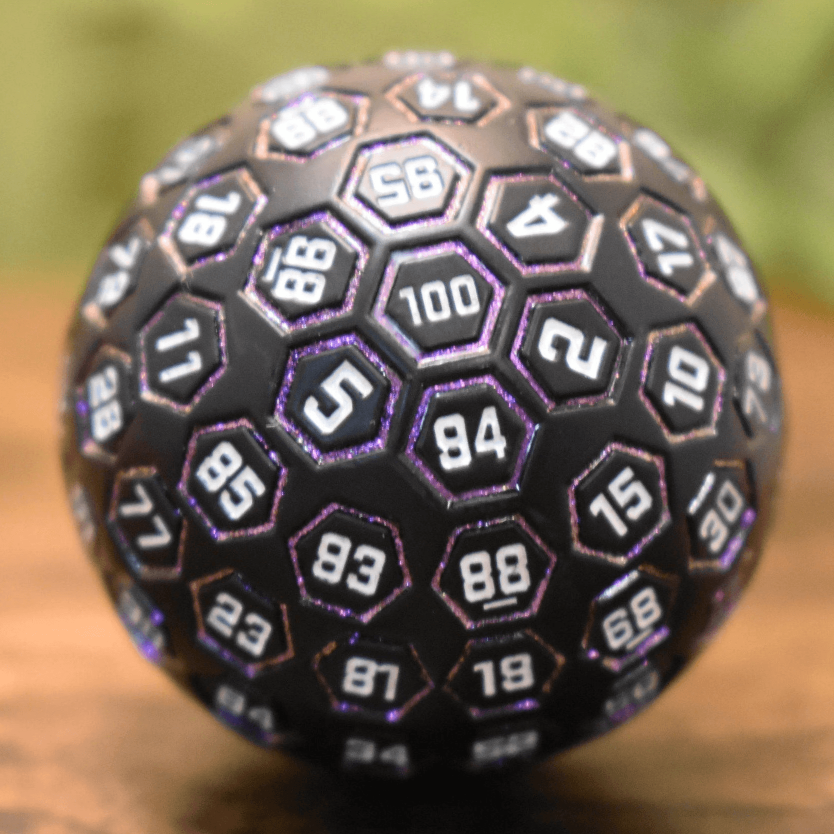 The Orb D100 - Purple, White, and Black Metal Die - 