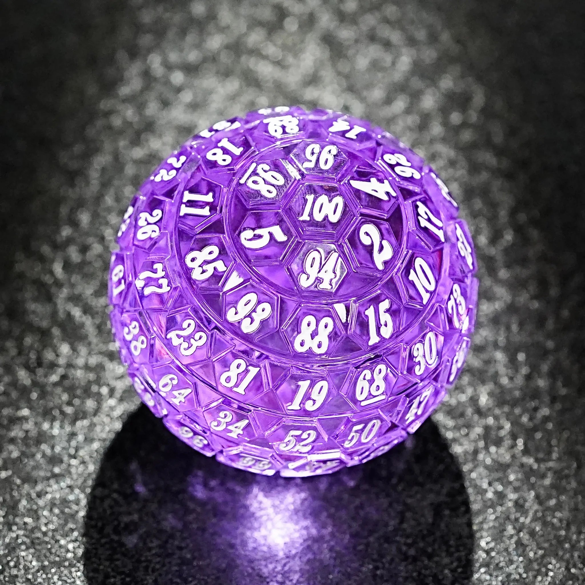 Transparent purple acrylic DND D100 dice with white numbers