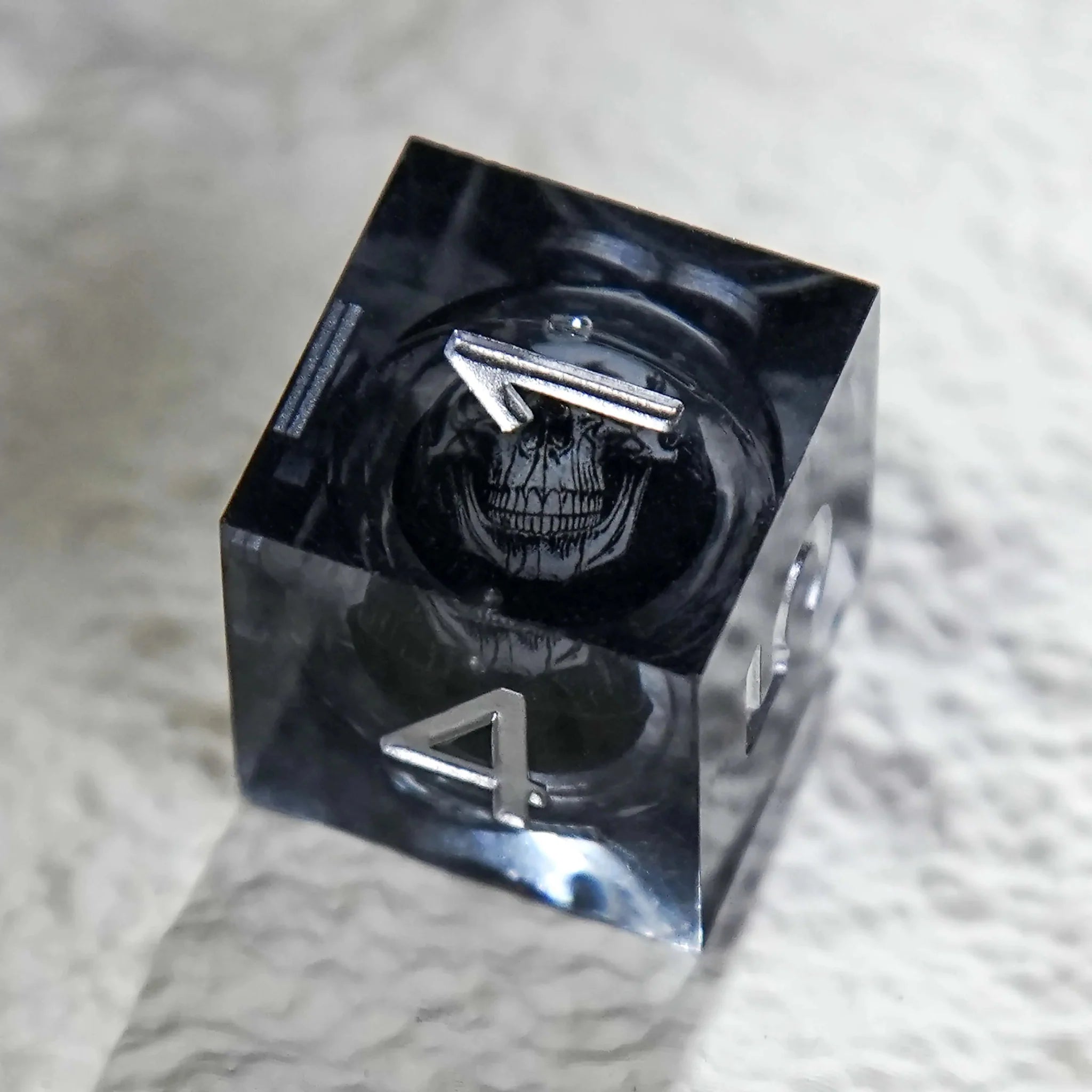 Dark Sorcerer's Skull Frame Liquid Core Resin Dice Set Silver Font