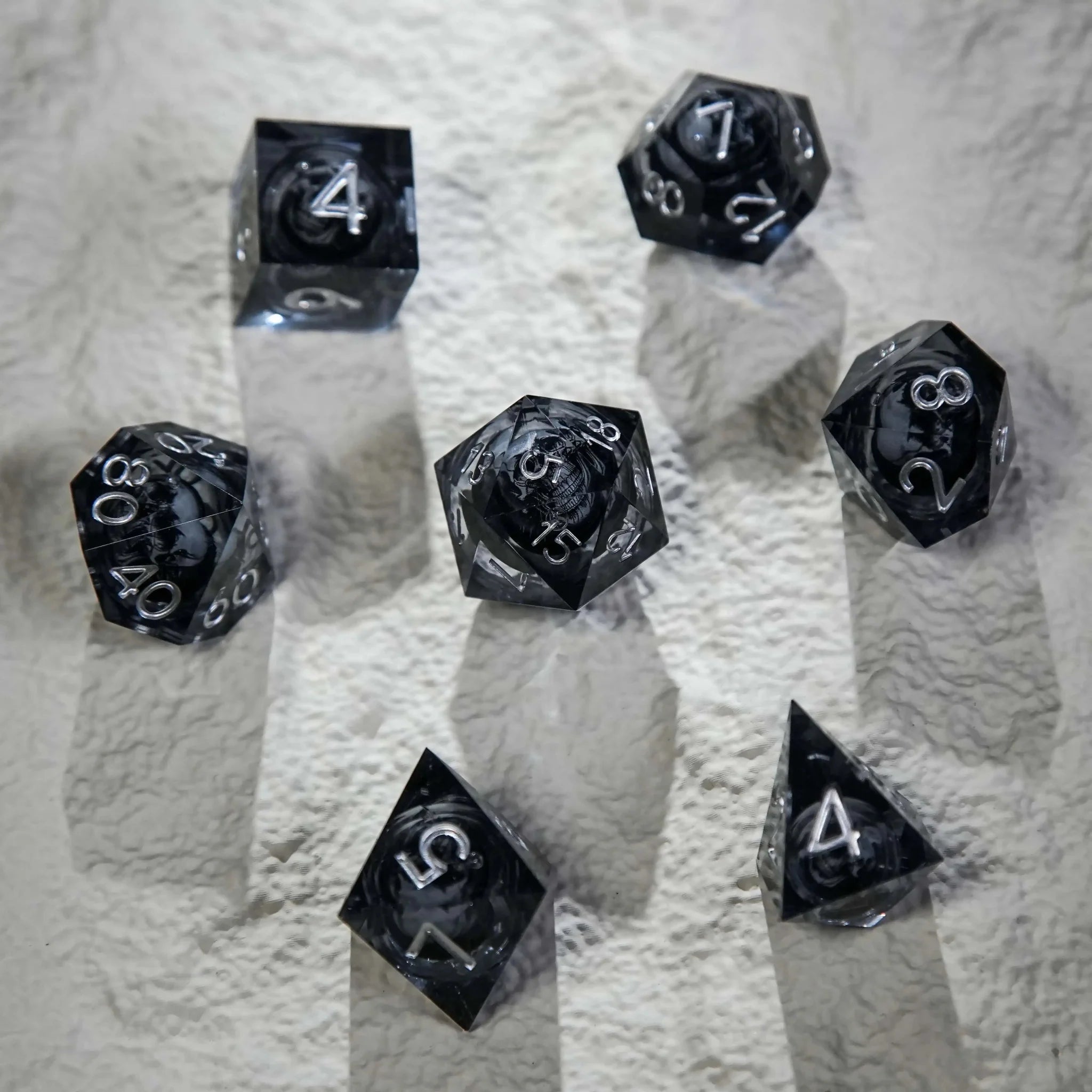 Dark Sorcerer's Skull Frame Liquid Core Resin Dice Set Silver Font