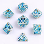Skull's Grin Hollow Metal Dice Set - Glow in the Dark Blue - 
