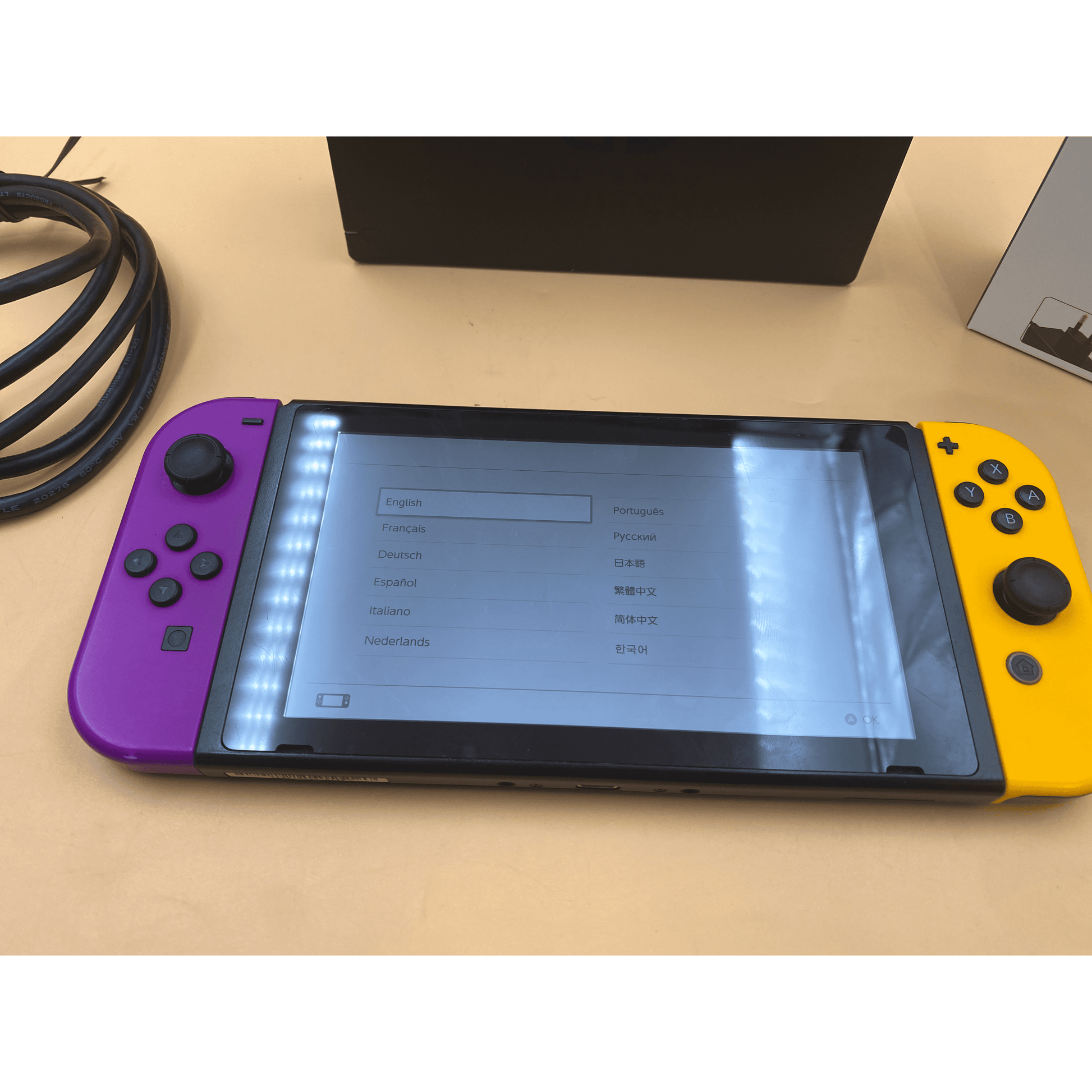 Nintendo Switch With Purple And Yellow Joy-Con